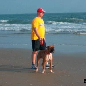 Junior Pulling Daddy Around the Beach