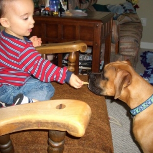 Alex feeding Lucy HIS snacks