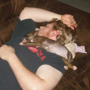 Bailey sleeping on daddy