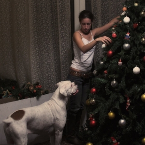Avra helps decorate the Christmas tree