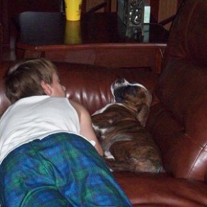 Caleb and our boxer Tyson sleeping together