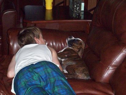 Caleb and our boxer Tyson sleeping together