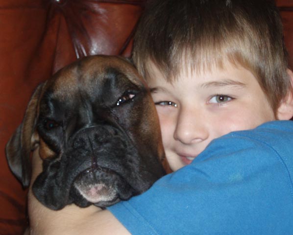 Ruby enjoying a hug from my youngest son